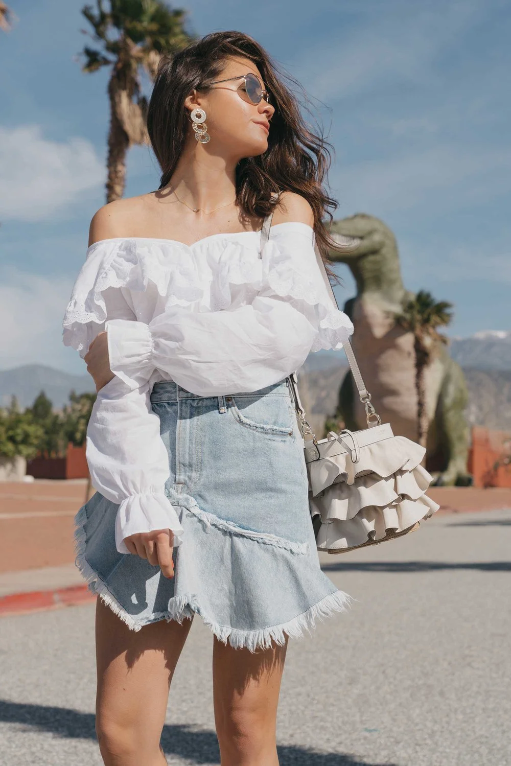 Festival-outfit-off-the-shoulder-ruffle-blouse-ruffle-denim-skirt-cabazon-dinosaurs7.jpg?type=w1200