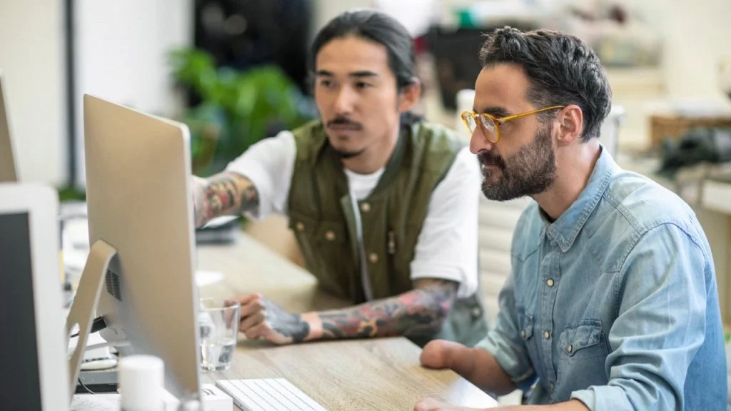 editorial-1143476209-two-men-on-computer-2880x1620.jpeg