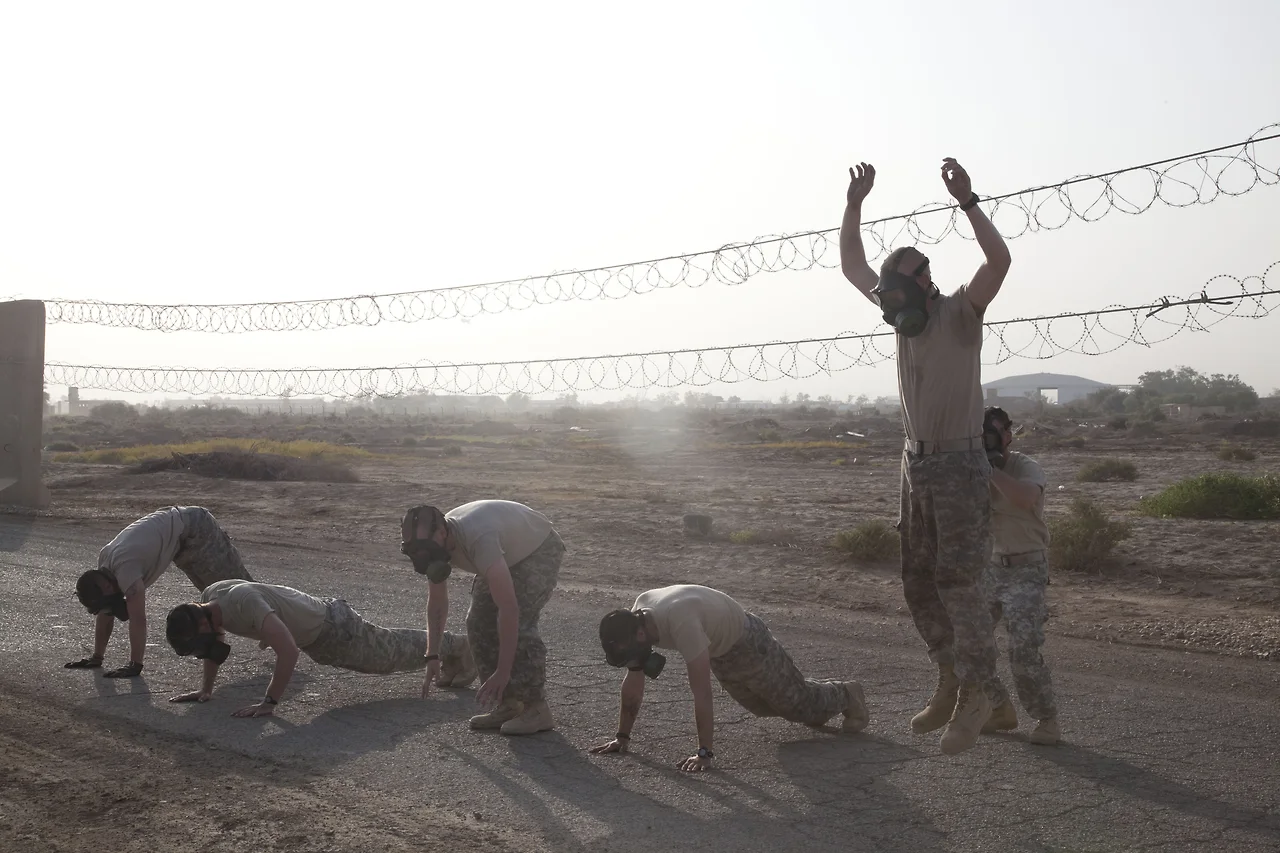 U.S._Soldiers_assigned_to_1st_Battalion,_3d_Brigade,_9th_Cavalry_Regiment,_perform_burpee_exercises_while_wearing_protective_masks_on_Contingency_Operating_Base_Delta_in_Wasit_province_Iraq,_July_15,_2011_110715-A-CH809-1.jpg