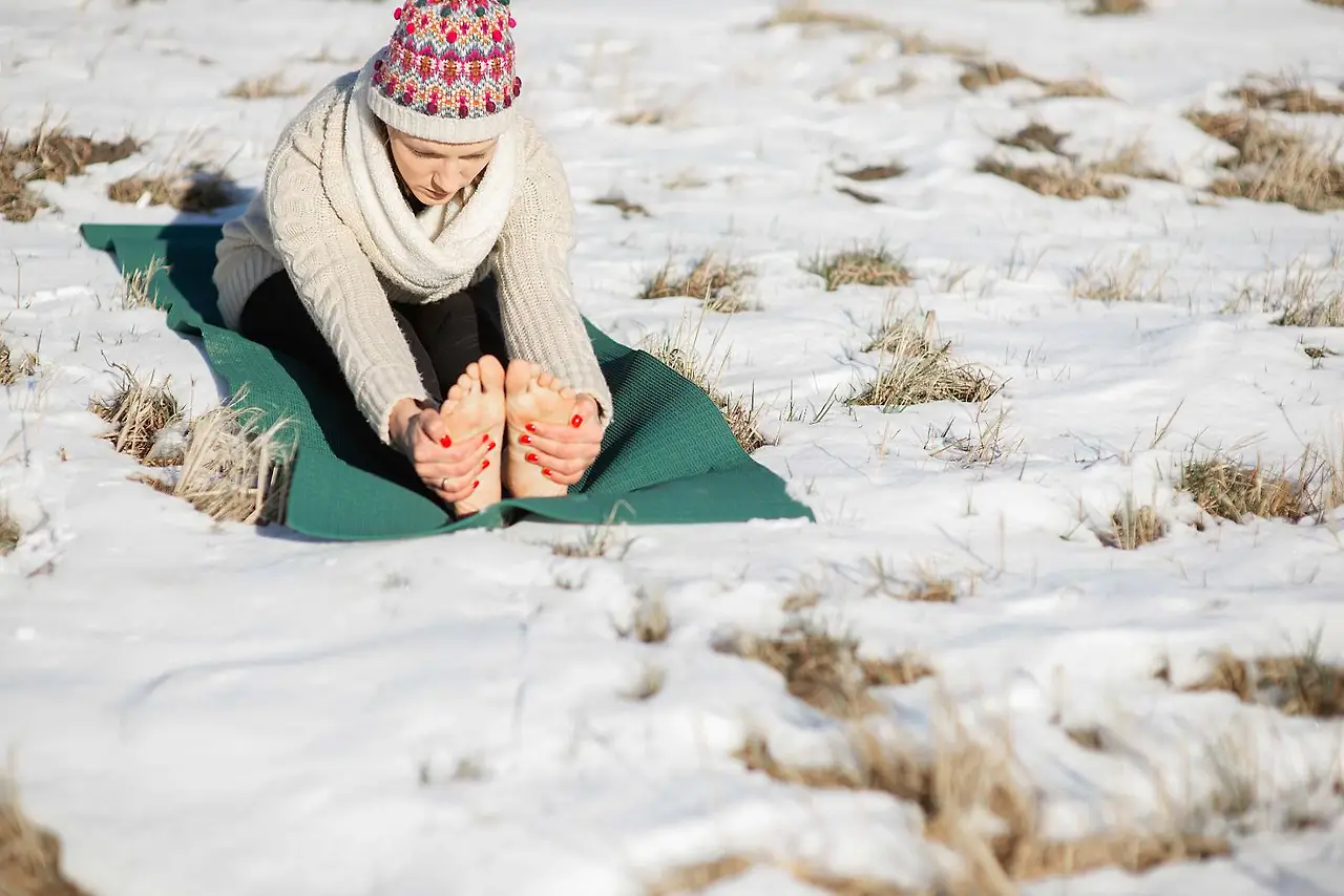 young-attractive-woman-practicing-yoga-snowy-field (1).jpeg