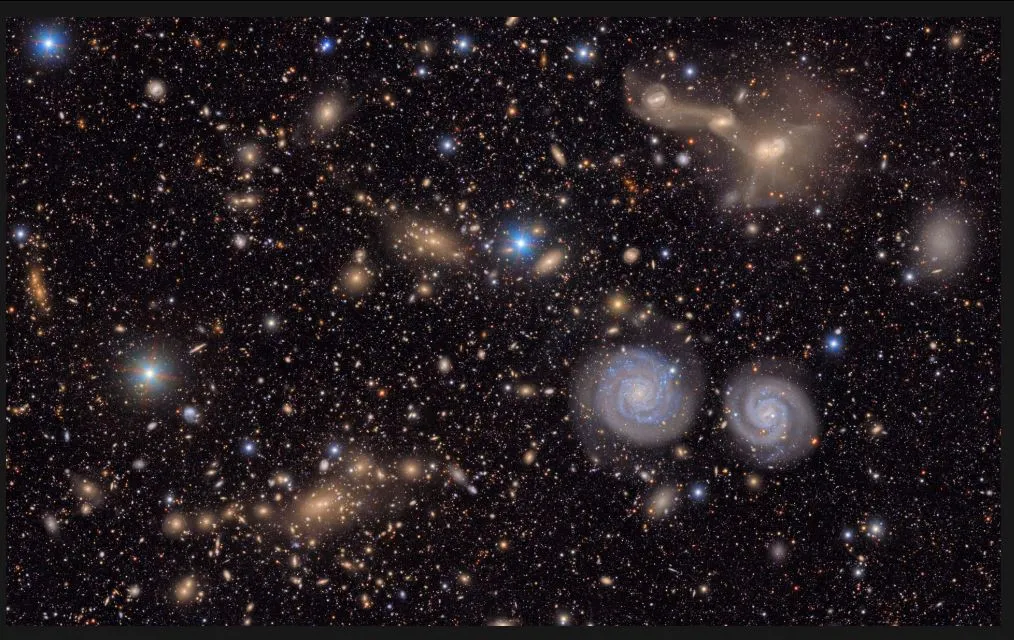 Space 27 06This image provided by the Vera C Rubin observatory shows a section of its total view of the Virgo cluster, with two prominent spiral galaxies (lower right), three merging galaxies (upper right), as well as several.JPG