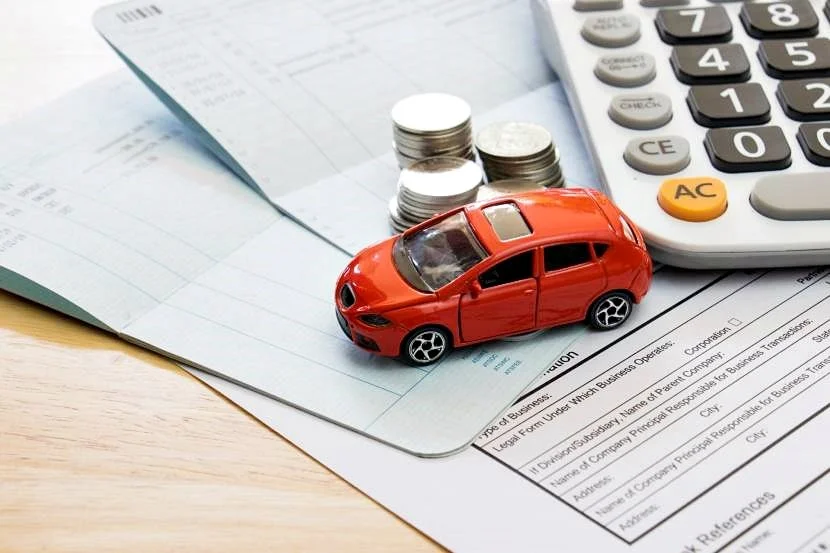 toy-car-with-money-and-calculator-article-image.jpg?type=w1200