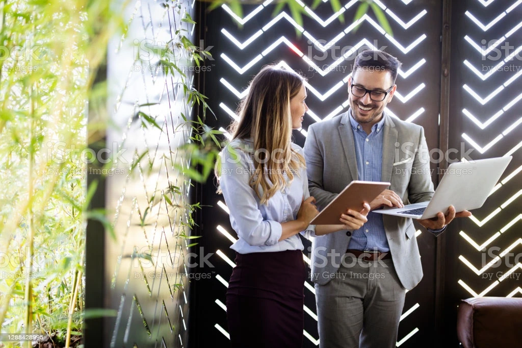 two-business-colleagues-at-meeting-in-modern-office-interior-picture-id1288428995?b=1&amp;k=20&amp;m=1288428995&amp;s=170667a&amp;w=0&amp;h=HV3MzIcbvZ3q6-xIDE8GPva6Ti86gl_ThEI0sU5NiFw=