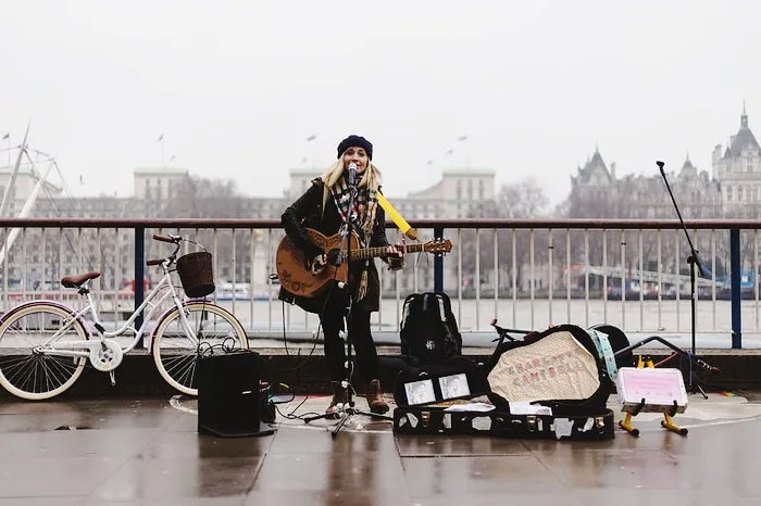 bicycle-singer-guitar-busking.jpg?type=w1600