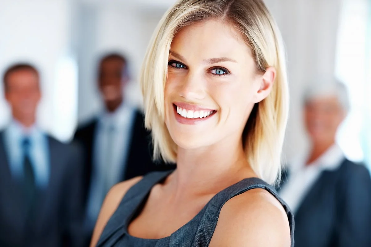 stockfresh_1243442_elegant-business-woman-with-team_sizeM.jpg?type=w1200