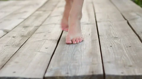 teenage-girl-walking-barefoot-tiptoes-footage-033967224_iconl.jpeg
