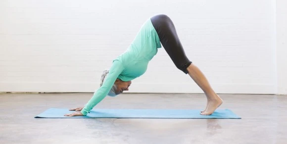 senior-woman-practicing-yoga-on-mat-royalty-free-image-1588014310.jpg?type=w580