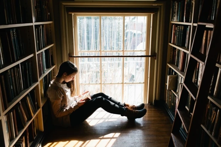 Young-Woman-Reading-Book.jpg?type=w2