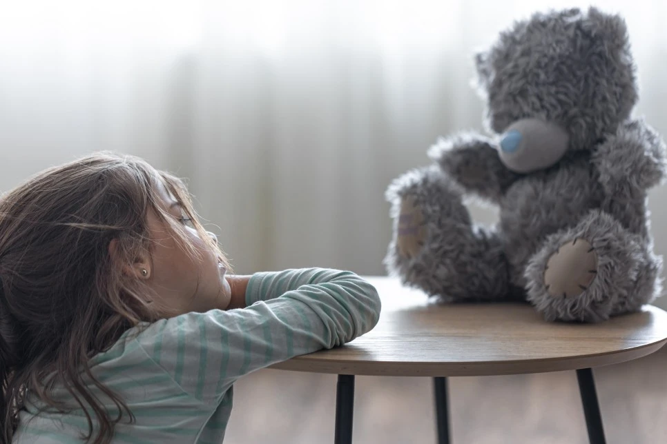 little-girl-looks-her-teddy-bear-child-with-favorite-toy-blurred-background-.jpg?type=w966
