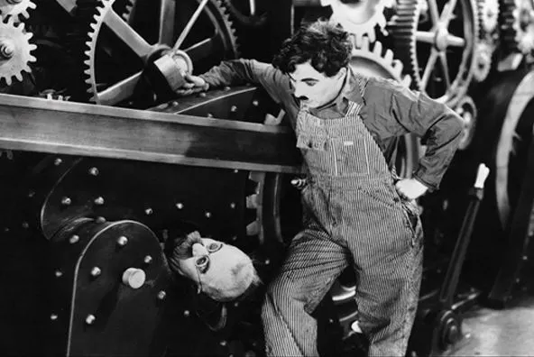 모던 타임즈-기계에 낀 노동자.JPG