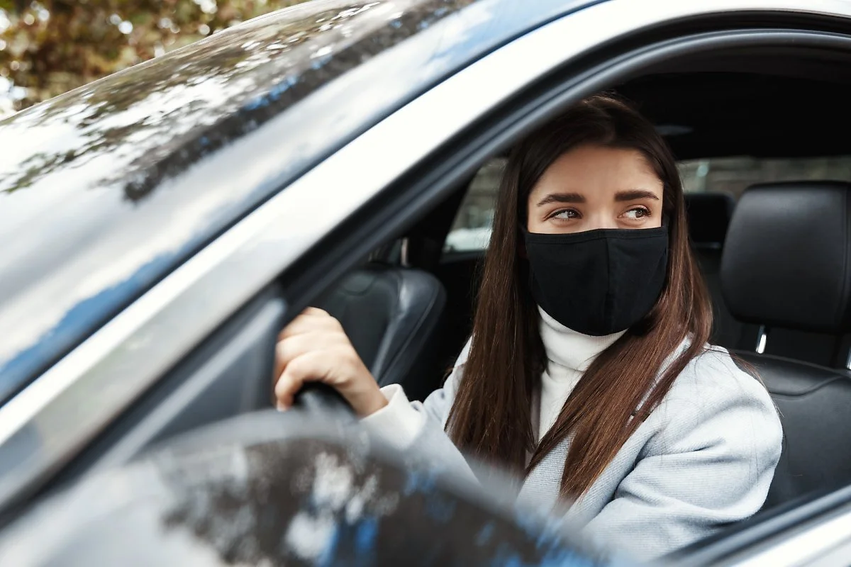 young-woman-driver-sitting-car-driving-work-face-mask.jpg?type=w1200