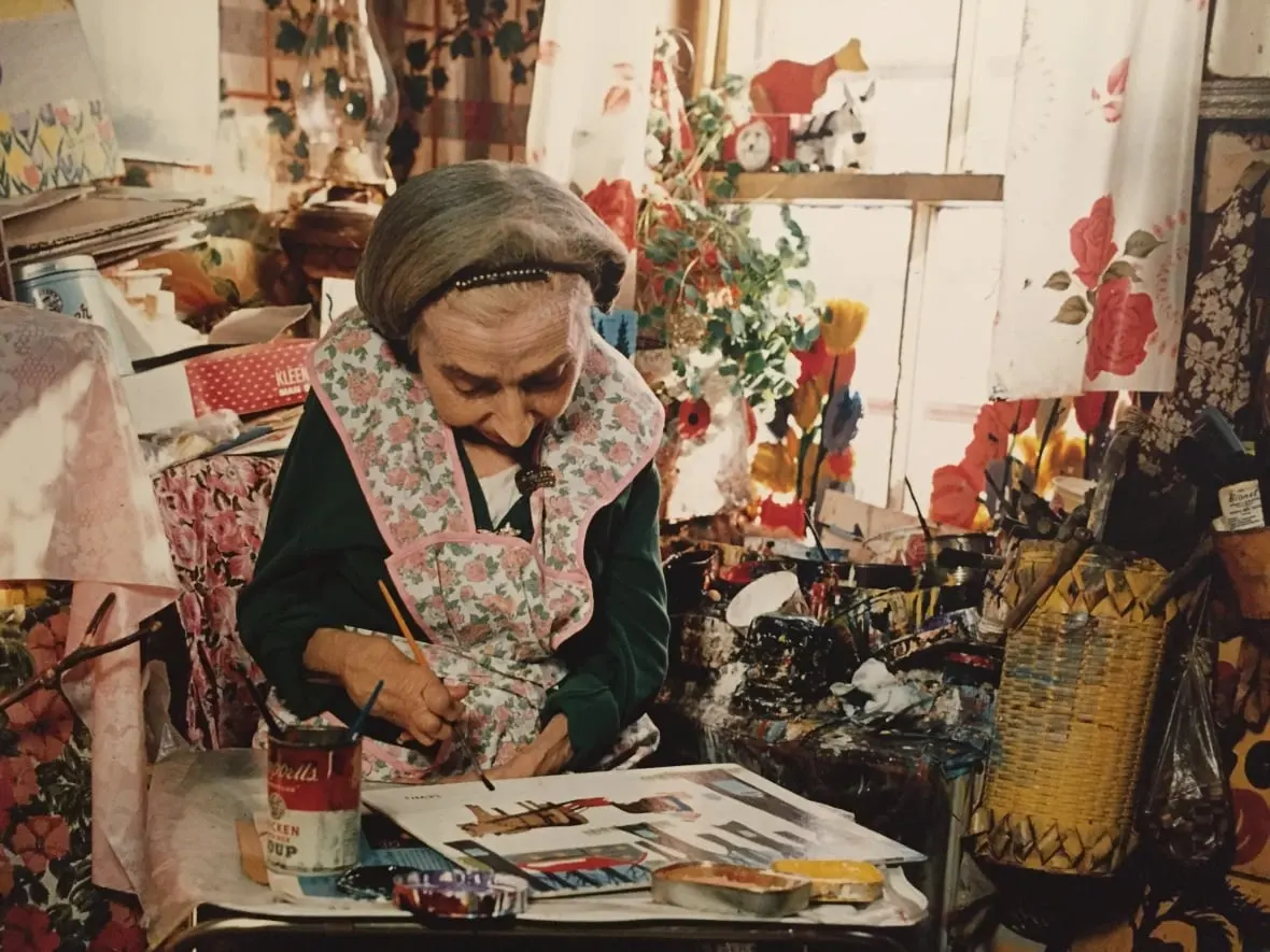 maud-lewis-works-on-a-painting-in-her-home.JPG