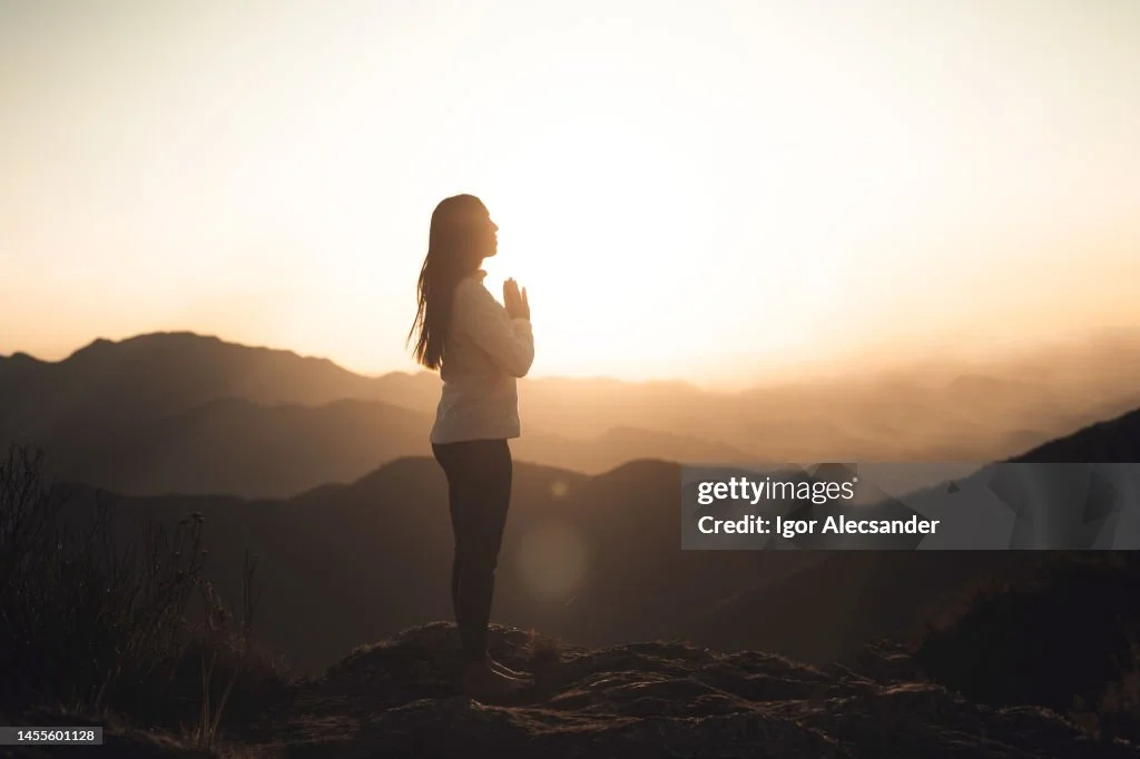 woman-meditating-at-sunset-in-the-mountains.jpg?s=1024x1024&w=gi&k=20&c=P11u53n3L5t6gOVOeUw8SyXgKmzdAGsofSo0zRmJIEY=