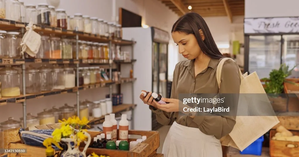 shot-of-a-young-woman-reading-the-label-of-a-bottle-in-a-grocery-store.jpg?s=1024x1024&w=gi&k=20&c=LCJ2be18hKVJ98cDYW1gTC33digb3xDheVHc6bQqcxs=