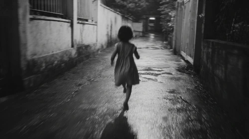 madmaiz_A_small_girl_running_down_a_narrow_street_at_dusk_no_cl_4e2a7cc1-134.png?type=w1
