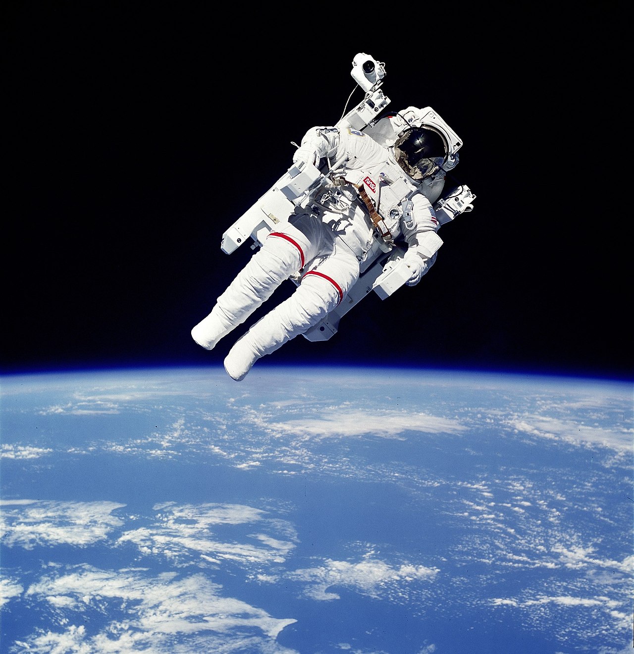 NASA astronaut Bruce McCandless II using a Manned Maneuvering Unit outside Space Shuttle Challenger