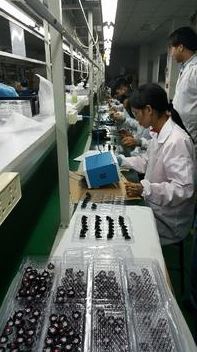 Workers assemble RippleBuds, an earbud that “talks through the ear,” at a Haebora plant in Shenzhen, China. (Haebora)