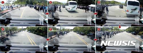 【광주=뉴시스】신대희 기자 = 제37주년 5·18민주화운동 기념식이 열린 18일 오전 광주 북구 운정동 국립 5·18 민주묘지에서 문재인 대통령의 탑승 차량과 경호 차량이 긴급 후송 중인 119 구급차를 위해 갓길로 차를 세운 사실이 알려지며 화재가 되고 있다.   1~6번 사진은 구급차 내부 블랙박스에 찍힌 영상을 캡처한 모습. 문 대통령의 경호·의전 차량이 출발한 상황에서 환자를 태운 구급차가 경호원의 도움을 받아 질주하고 있다. 2~6번은 달려오는 구급차를 피해 문 대통령 경호차량과 의전 차량들이 도로 옆으로 비켜서 차를 세우고 있는 모습. 2017.05.18. (사진 = 광주 북부소방서 제공 동영상 캡쳐)    sdhdream@newsis.com