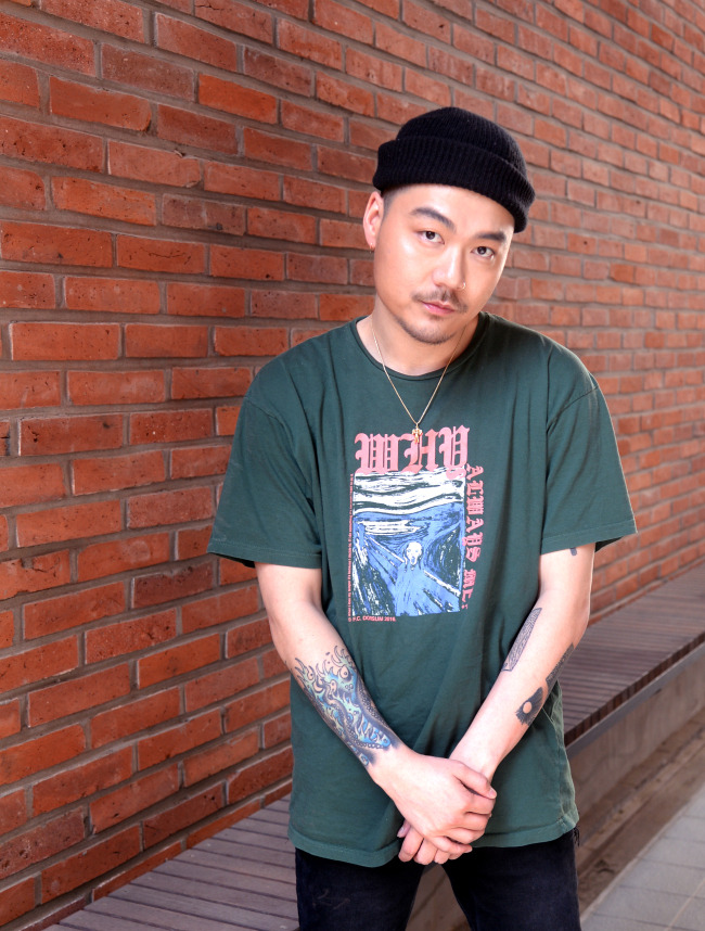 Rapper Dumbfoundead (Park Sung-man) poses for a photo before an interview at Herald Square on Thursday. (Park Hyun-koo/The Korea Herald)