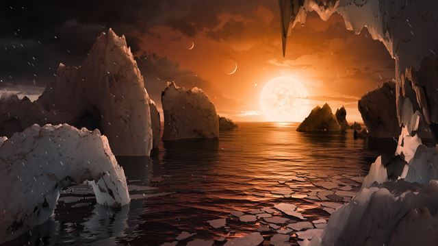 TRAPPIST-1 행성계에서 중심별(TRAPPIST-1) 주위를 5번째로 돌고 있는 행성의 표면을 그린 상상도. 미국과 유럽 과학자들은 이곳에 액체 상태의 물이 존재할 수 있을 것으로 추정하고 있다. 미국 항공우주국, 캘리포니아공대 제공