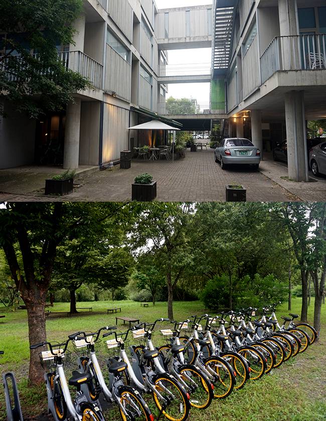 파주출판도시의 출판사 건물(위)은 상업, 업무, 주거기능을 수직적으로 배치한 곳이 많다. 아래는 문발로 인근 소공원 앞에 비치된 'e바이크' 자전거대여시스템.