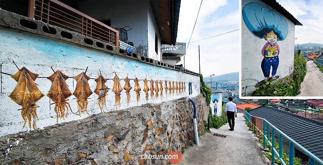 묵호의 달동네 골목은 사진 속 벽화처럼 한때 오징어와 명태 따위가 한가득 널려 있었다. 이 때문에 온 동네가 논처럼 질펀하다고 해 ‘논골담길’이라고 불렸다. 오징어 그려진 벽화 따라 쭉 논골2길을 걷다 보면 원더우먼을 패러디한 ‘원더할매’ 벽화가 있다. / 김종연 영상미디어 기자