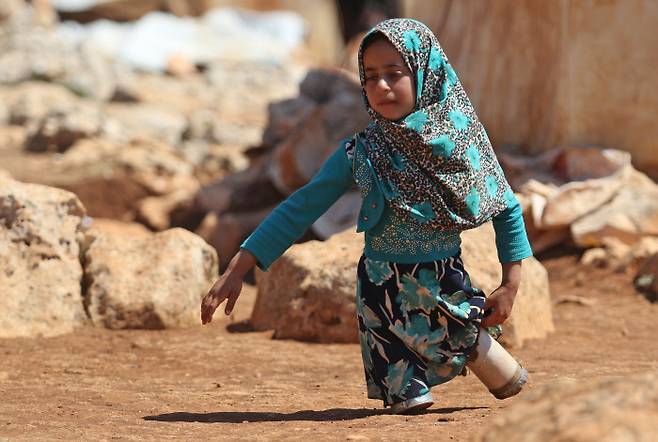 ¸¶¾ß°¡ ±øÅëÀÇÁ·À» Çϰí Çб³·Î °¡°í ÀÖ´Ù.AFP¿¬ÇÕ´º½º