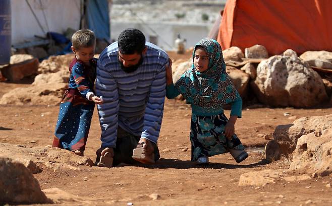 ³¹ÎÄ·ÇÁ ¾È¿¡¼ »ýȰÇÏ´Â ¸¶¾ß °¡Á·. AFP ¿¬ÇÕ´º½º