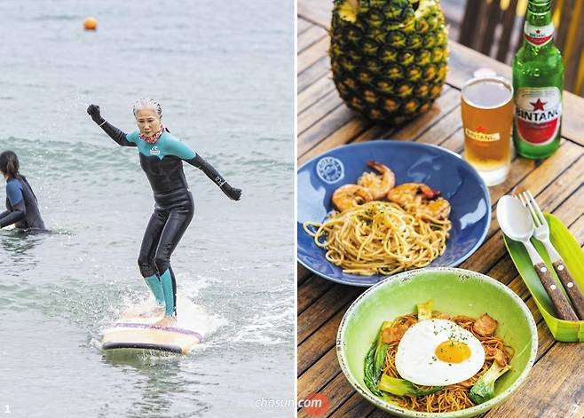 1 부산 송정해변에서 서핑하는 장년 서퍼 양정숙씨. 2 부산 송정해변의 서퍼 맛집 '비스트로 하이'의 쉬림프파스타와 미고랭.