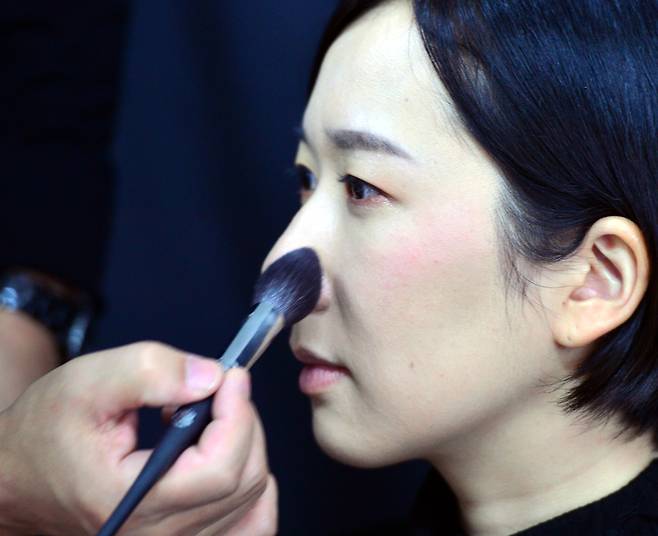 Apply blush slightly above the cheeks. (Park Hyun-koo/The Korea Herald)