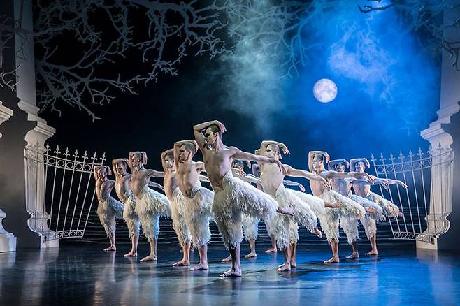 Matthew Bourne's SWAN LAKE. Will Bozier 'The Swan' and ensemble. Photo by Johan Persson