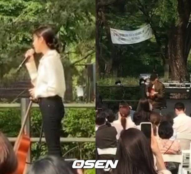 지난 17일 밴드 혁오의 기타리스트 임현제의 결혼식에서 가수 아이유(왼쪽)와 혁오의 보컬 오혁이 축가를 부르고 있다. /사진=OSEN