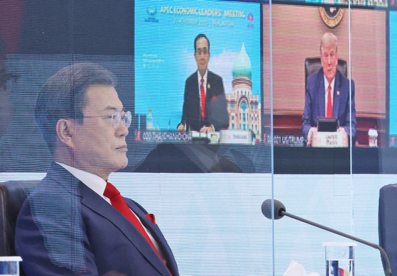 President Moon Jae-in on Friday participates from the Blue House during a virtual summit of the Asia-Pacific Economic Cooperation. [YONHAP]