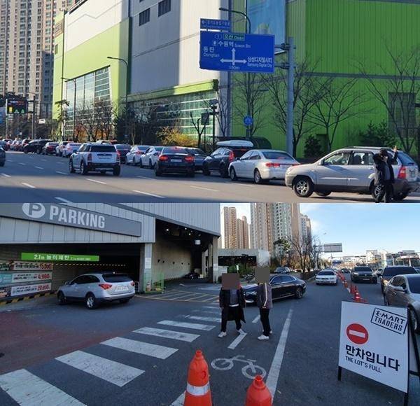 28일 오후 이마트 트레이더스 수원신동점에 들어가려는 차량이 줄을 서 있다. 주차장 입구에는 만차를 알리는 표지판이 세워졌다. /이선목 기자