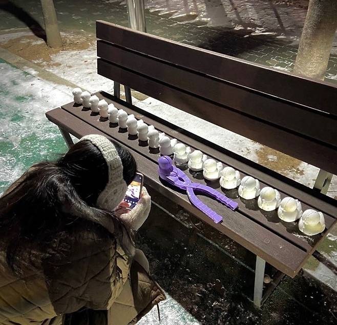 Lee Yea-sul takes pictures of snow ducks (Courtesy of Lee)