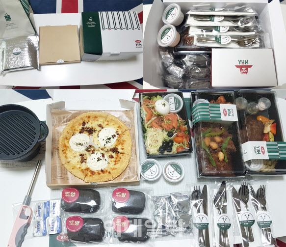빕스 얌 딜리버리 서비스로 주문한 빕스 뉴욕스테이크, 바비큐 폭립 얌 플래터, 빕스 연어&부라타 치즈 샐러드, 멜팅 콰트로 치즈 피자와 서비스 얌 브레드 언박싱(Unboxing) 타임.(사진=김범준 기자)