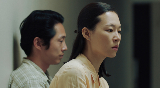 Actors Han Ye-ri, right, and Steven Yeun portray the couple Monica and Jacob in the film ″Minari.″ [PAN CINEMA]