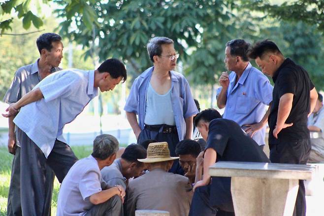 A group plays a board game in Pyongyang in August 2019. (Lindsey Miller)