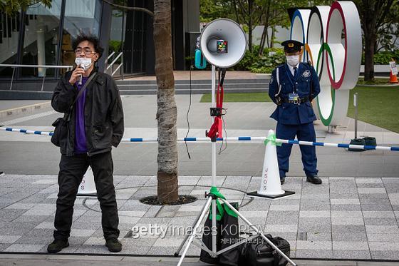 일본 시민이 올림픽을 취소하라는 시위를 하고 있다.  사진=게티이미지