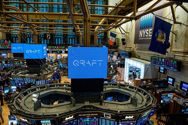 A Qraft Technologies logo is displayed on the New York Stock Exchange on the debut day of its exchange-traded fund products in May 2019. (Qraft Technologies)