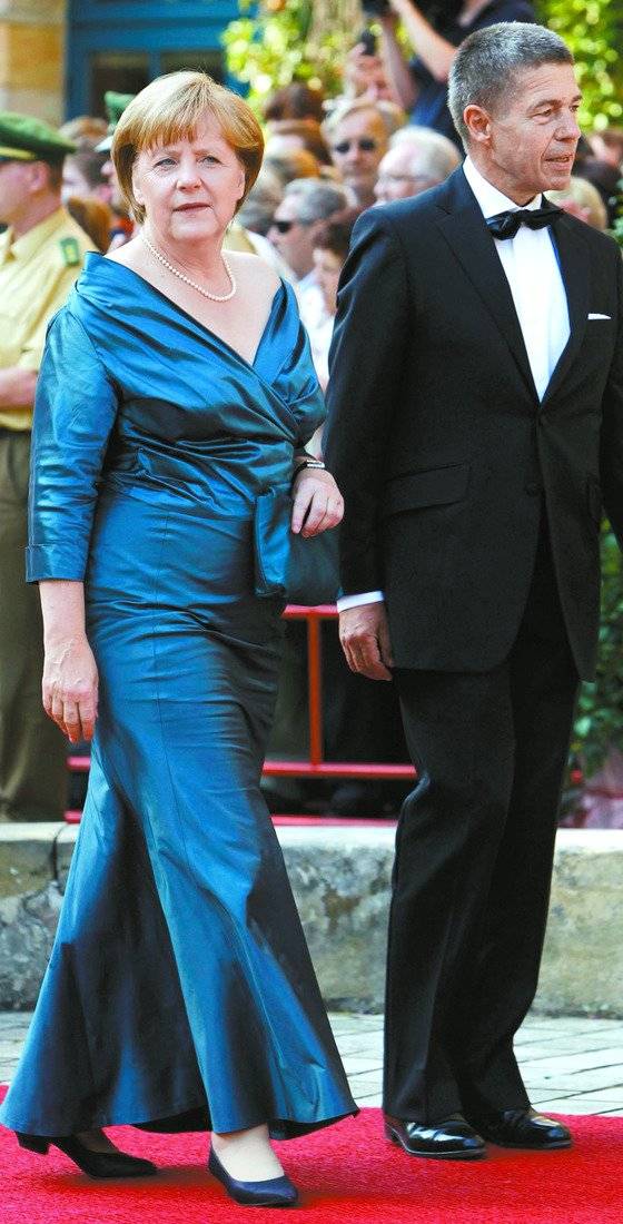 앙겔라 메르켈 총리와 남편 요아힘 자우어는 독일 축구와 오페라, 음악가 바그너를 좋아한다는 공통분모가 있다. 로이터=연합뉴스