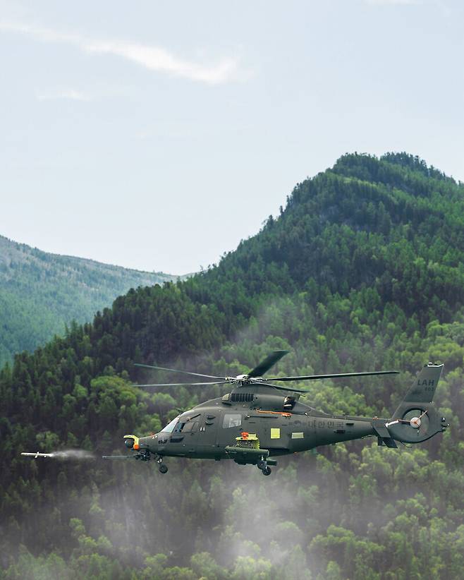 A light-armed helicopter fires a missile. (provided by Korea Aerospace Industries)