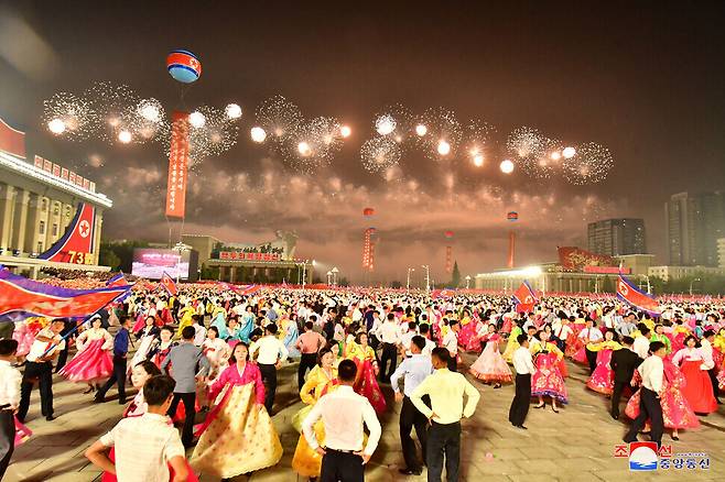 Young people dance at a “night ball” held at night in Kim Il Sung square on Thursday, marking the 73rd anniversary of North Korea’s founding. (KCNA/Yonhap News)