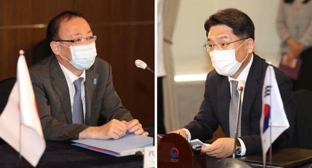 노규덕 외교부 한반도평화교섭본부장(오른쪽)과 일본의 북핵 수석대표인 후나코시 다케히로 외무성 아시아대양주국장. <힌겨레> 자료사진