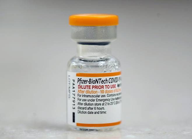 A vial of Pfizer COVID-19 vaccine waits to be dispensed to pediatric patients at National Jewish Health, during the pediatric vaccine rollout Wednesday, Nov. 3, 2021, in east Denver. Several dozen children were the first in the Mile High City to receive a vaccination against the coronavirus. (AP Photo/David Zalubowski)