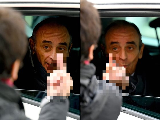 한 시민이 에릭 제무르에게 손가락 욕을 하자 똑같이 응수하고 있는 그의 모습. [AFP]