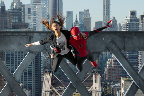 MJ (played by Zendaya) and Spider-Man (played by Tom Holland) jump off a bridge in "Spider-Man: No Way Home," slated to premiere in local theaters on Dec. 15. [SONY PICTURES]