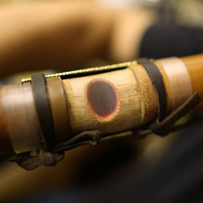 A close-up view of Won Jang-hyun’s daegeum cheong, a translucent membrane from reed grass, which vibrates when the large bamboo flute is played. &nbsp;Photo © Hyungwon Kang