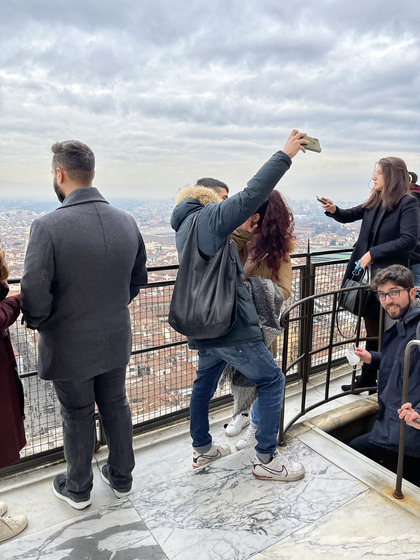 Tourists enjoy the view from atop the Duomo in Florence, Italy last month.