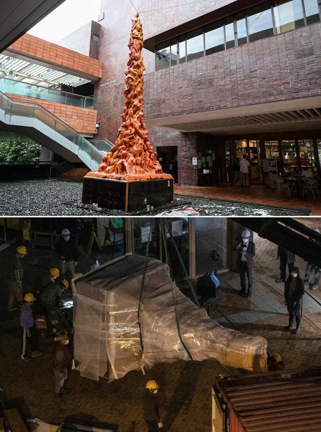 지난달 23일 홍콩의 홍콩대 교정에 설치된 중국 천안문 사태 추모 조각상 '수치의 기둥'(위 사진)이 인부들에 의해 철거되고 있다.(아래 사진) 홍콩=AFP 연합뉴스